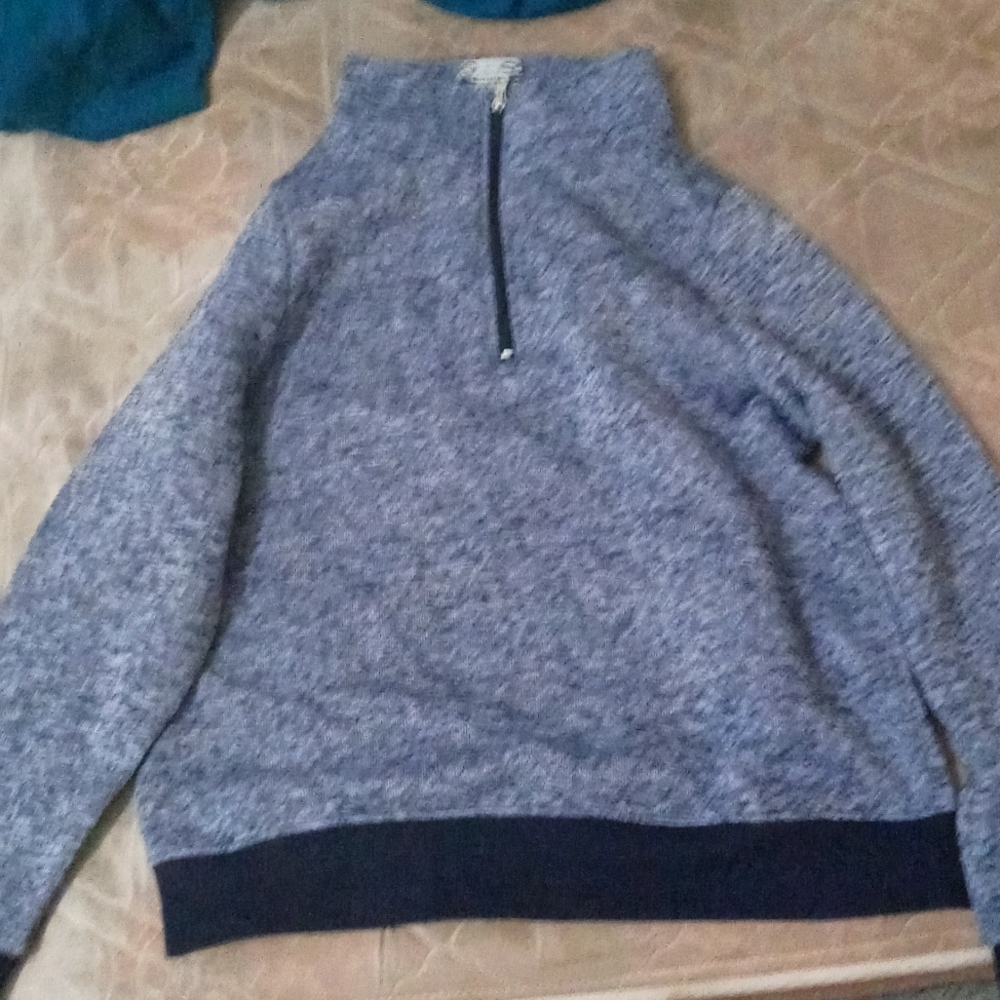 Turtle neck sweater.